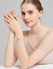 Model Wearing Sterling Silver and Natural Pearl Bracelet - Elegant Nature-inspired Jewelry