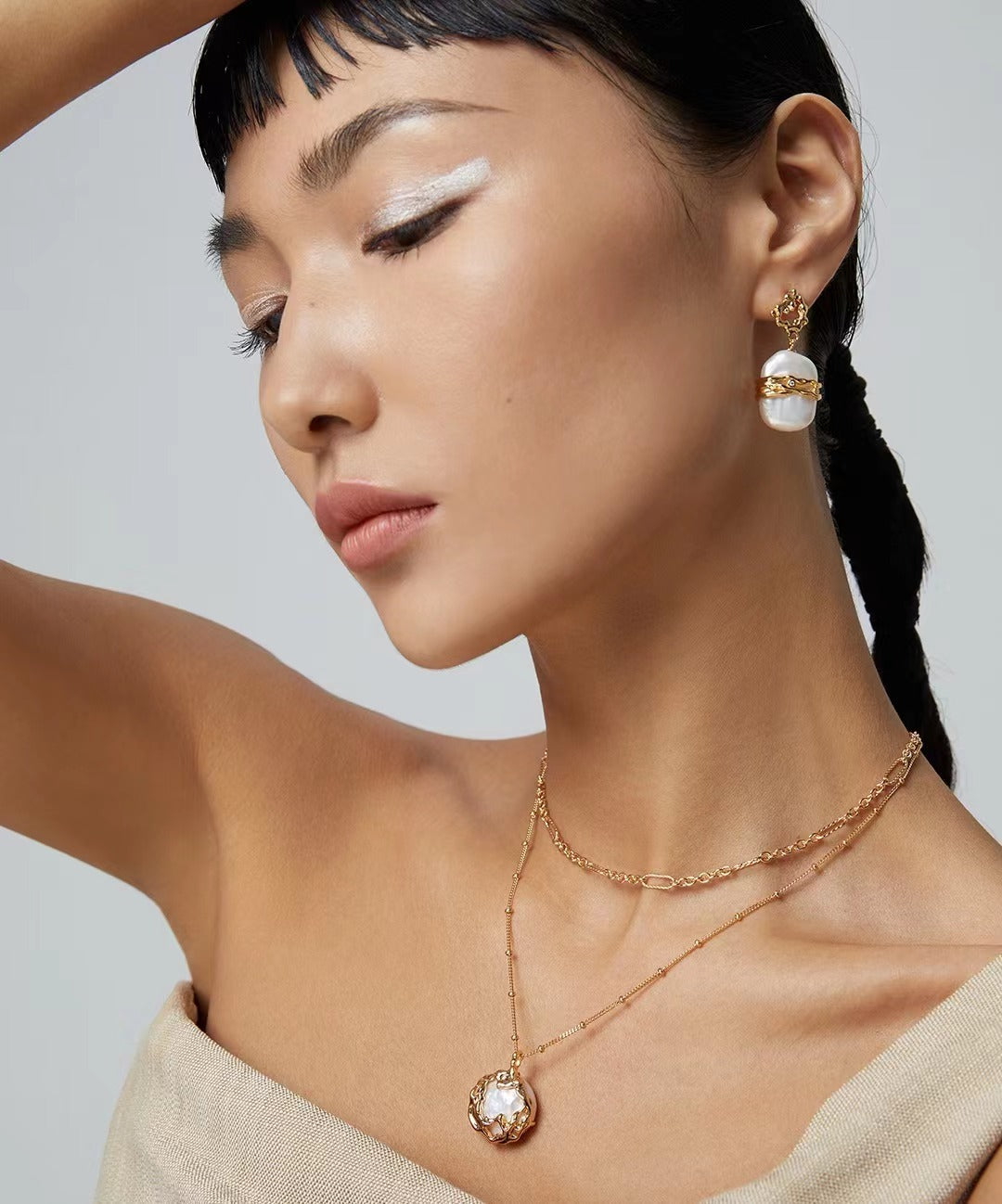 Model Wearing Pure Silver Pearl Necklace - Elegance in Gold