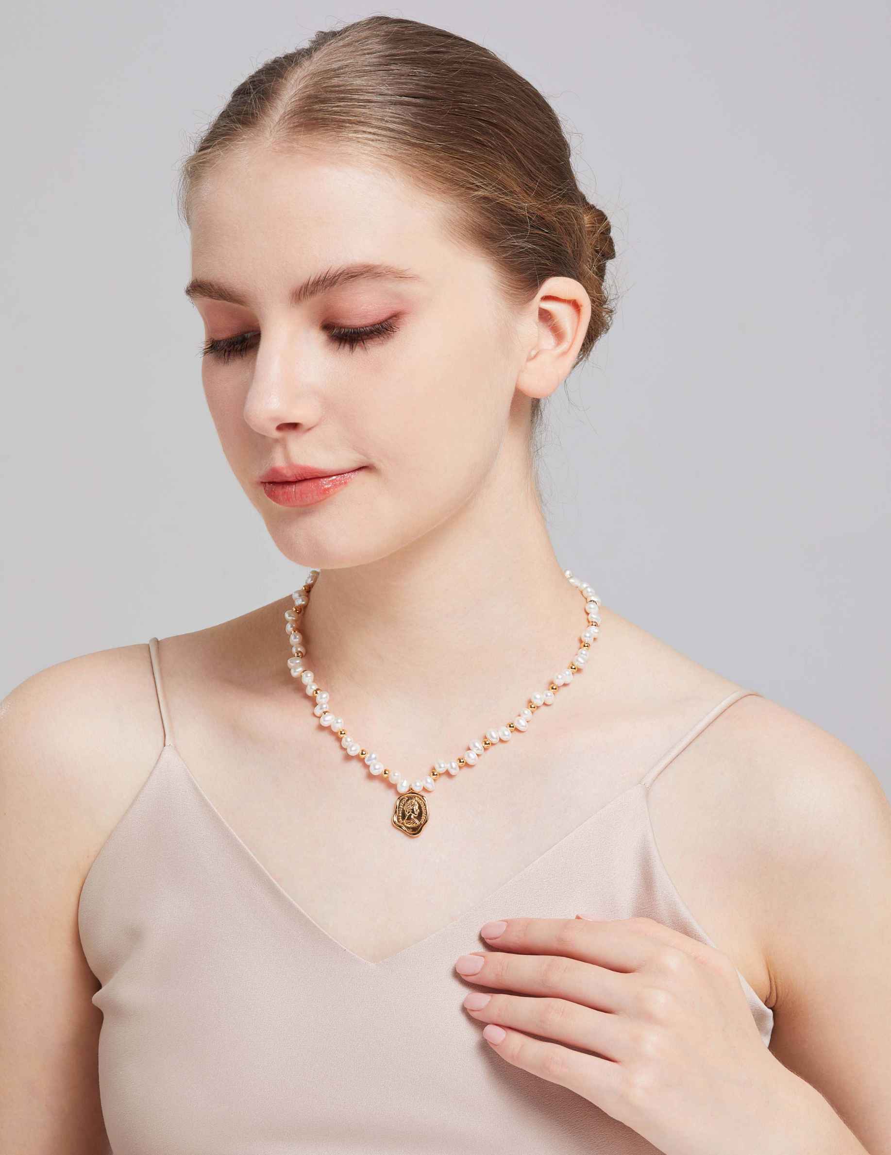 Elegant Female Model Wearing Pearl Necklace
