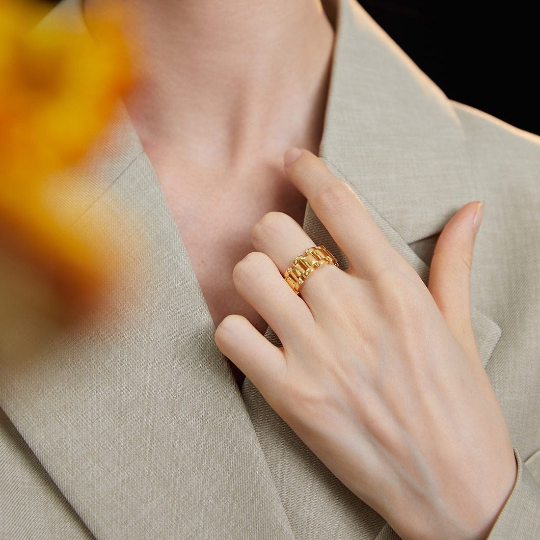 Model showcasing Vivienne Sterling Silver Bracelet Ring paired with elegant attire.