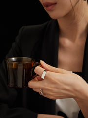 Model elegantly wearing Amelia Sterling Silver Ring, highlighting its minimalist luxury fashion style