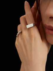 Model pairing the Amelia Sterling Silver Ring with casual and formal outfits, displaying its versatility