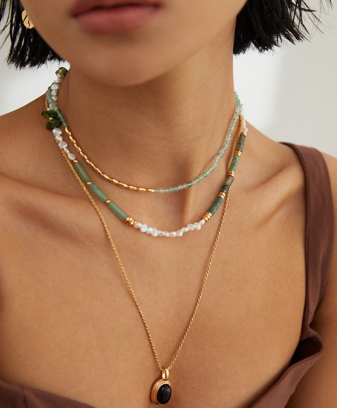 Model showcasing Reese Sterling Silver Pearl Necklace, highlighting its eclectic style