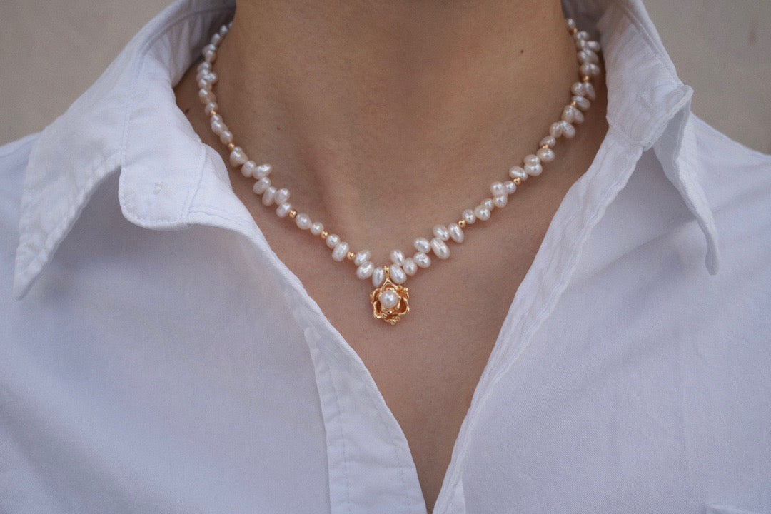 Model showcasing the Madeline Camellia Pearl Necklace