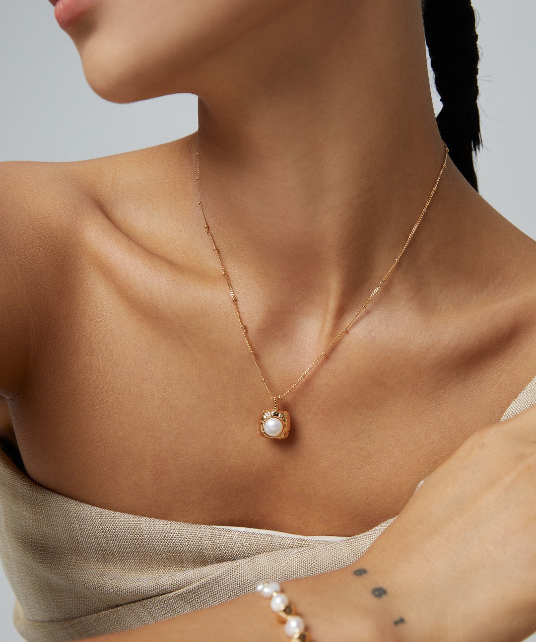 Model showcasing the Kaitlyn Sterling Silver Pearl Necklace