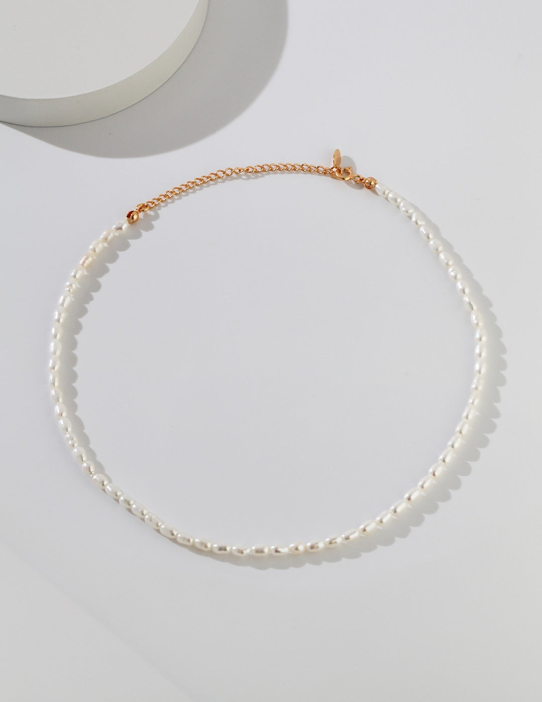 Faith Sterling Silver Natural Rice Pearl Necklace laid flat