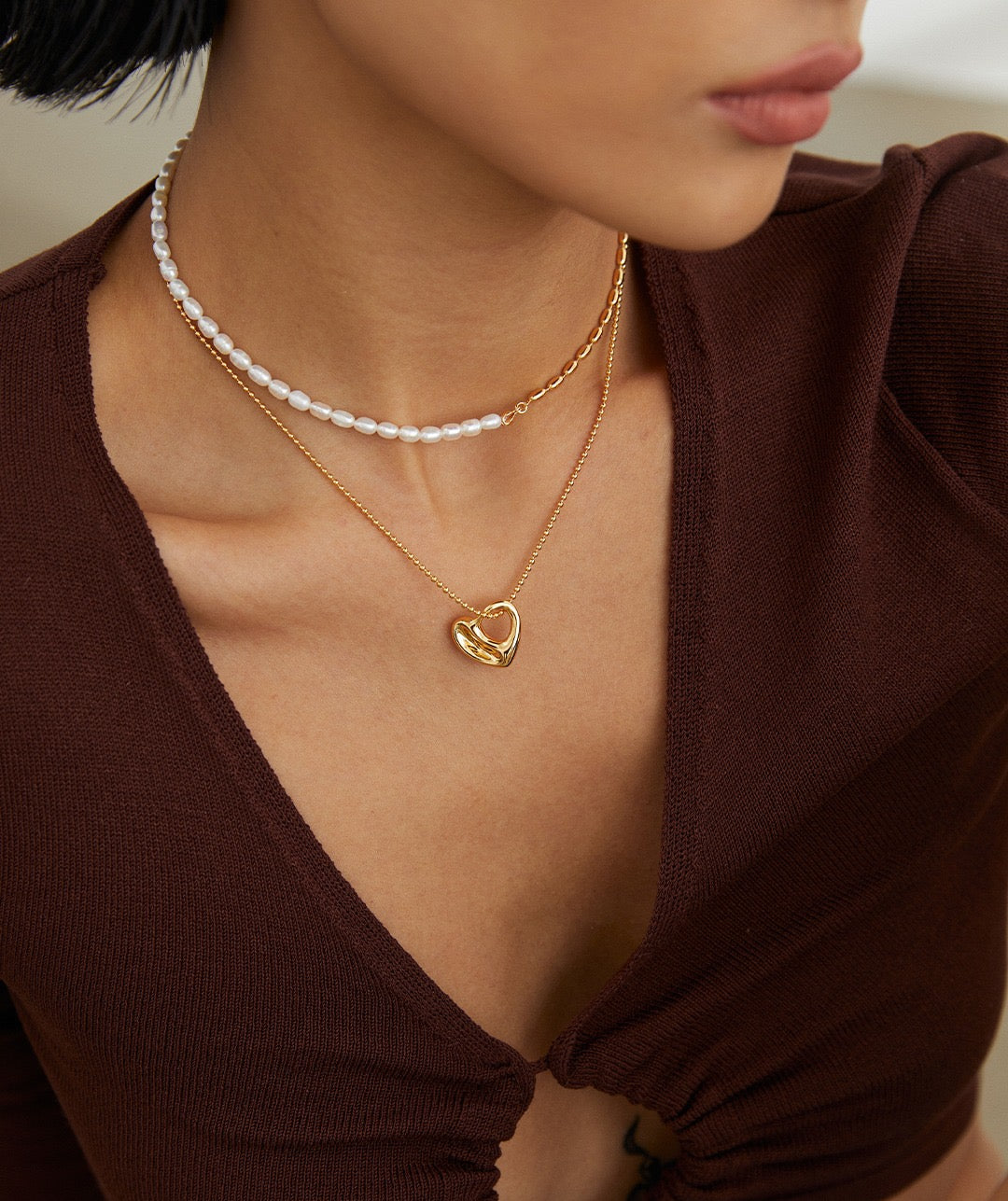 Close-up of Model's Collarbone with Yara Sterling Silver Heart-Shaped Necklace