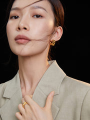 Model showcasing Elysia Watch Chain Earrings, emphasizing the earring's length and elegance