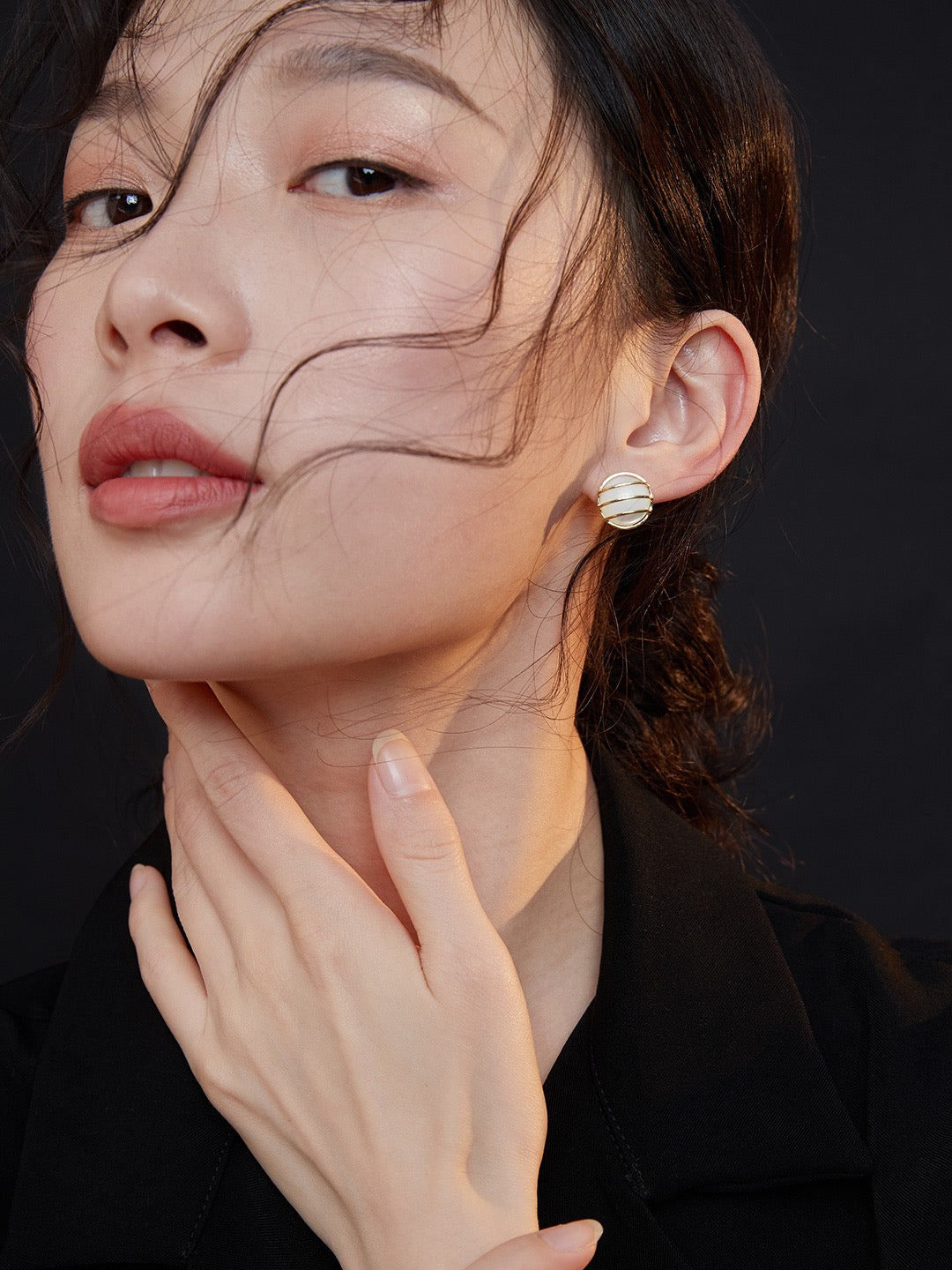 Model's close-up face shot highlighting the Charlotte Pure Silver Mother-of-Pearl Earrings