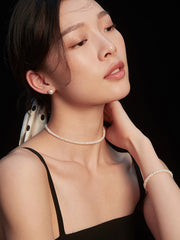 Side view of model showcasing the Aurelia Pearl Earrings