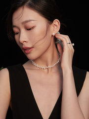 Model's face close-up, highlighting the Aurelia Pearl Earrings in natural light