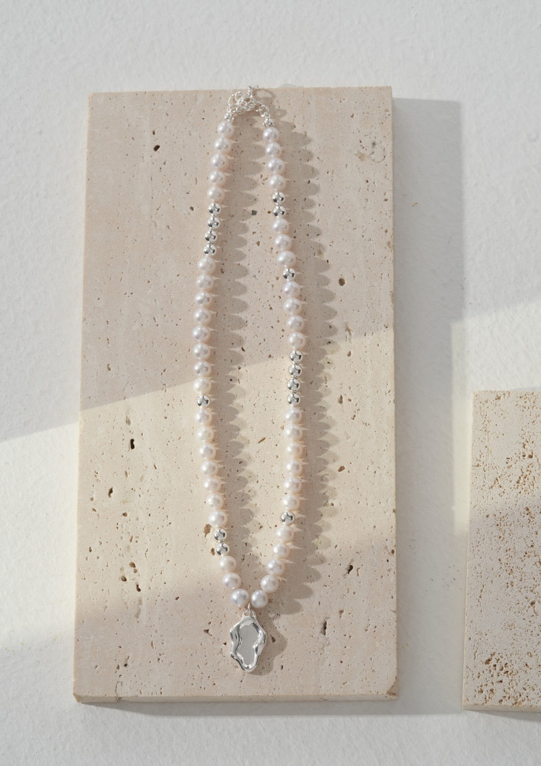 Close-up view of Ava Mirror Series S925 Silver and Natural Pearl Necklace